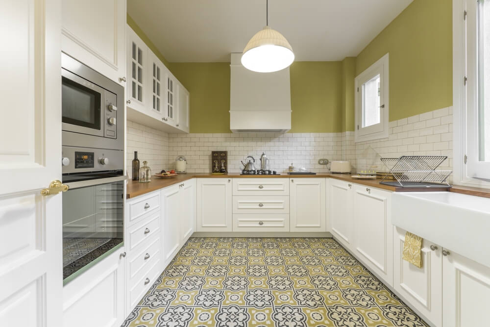 Vintage-Style-Kitchen-Furnished-in-a-U-Shaped-White-Lacquered-Wood-With-Wooden-Countertop-White-Tiles