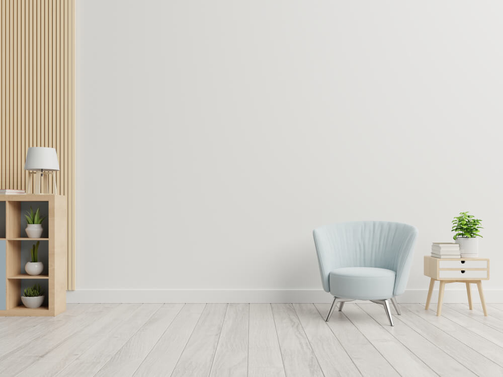 The Minimalist Inspired Interior With a Armchair on Empty White Wall Background